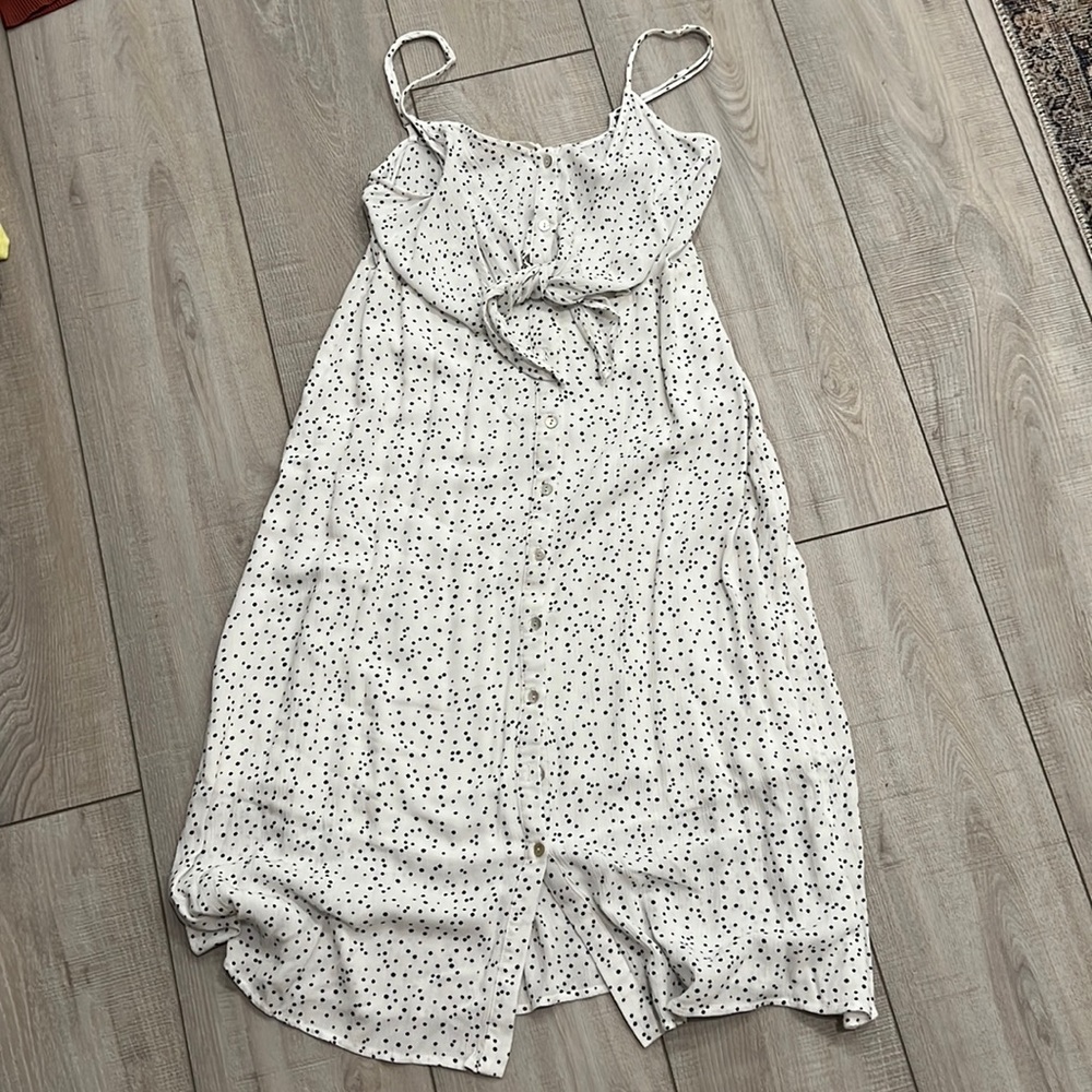 Adjustable thin strap dress. Top to bottom button closure. Tie closure in front